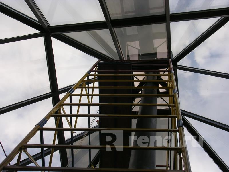 Тонировка стеклянной крыши здания пленкой (Бронза 20%).. Фото - пример тонировки алюминиевого остекления крыши здания.